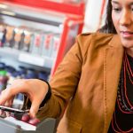 woman using phone to pay