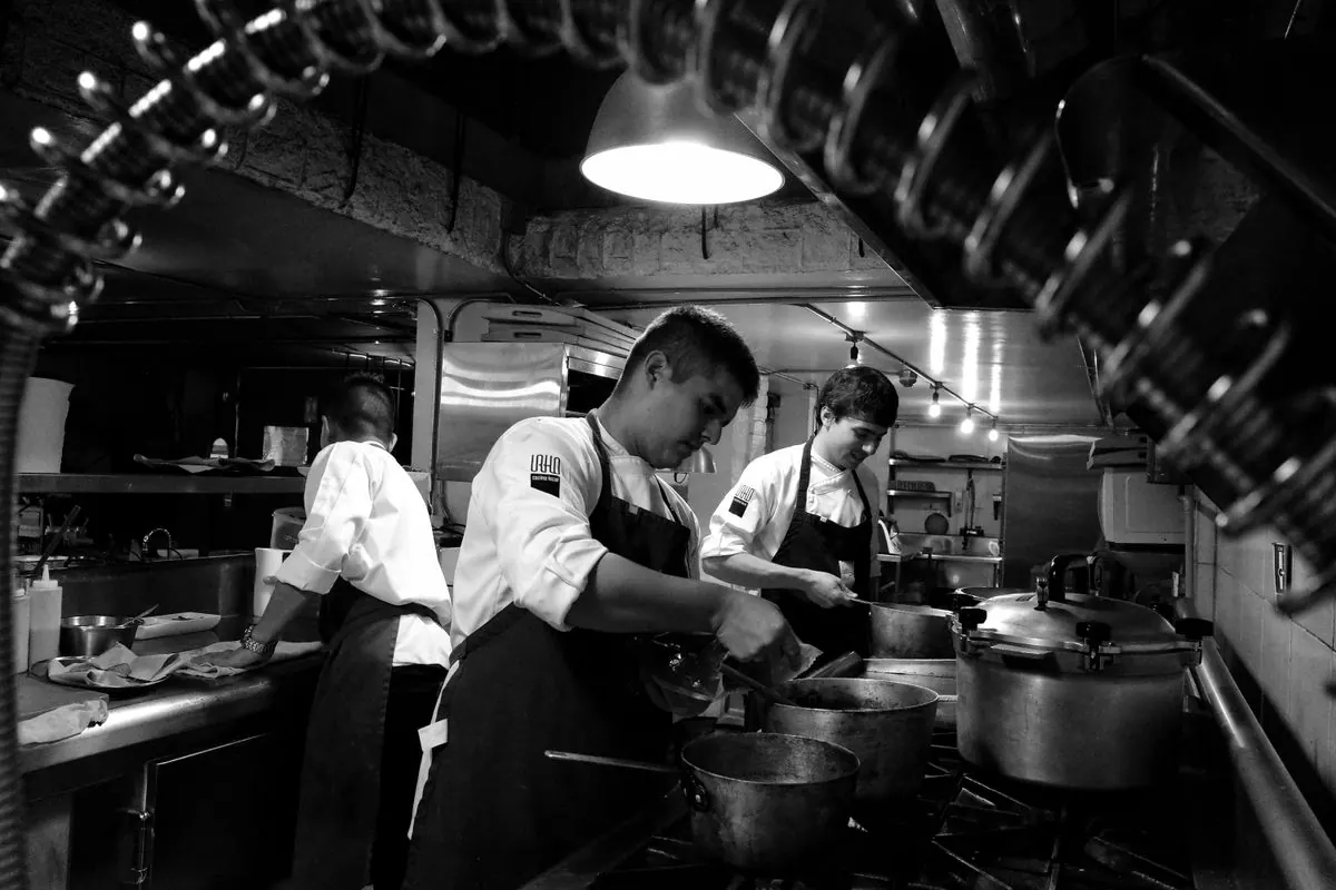 Kitchen team cooking during a busy dinner service
