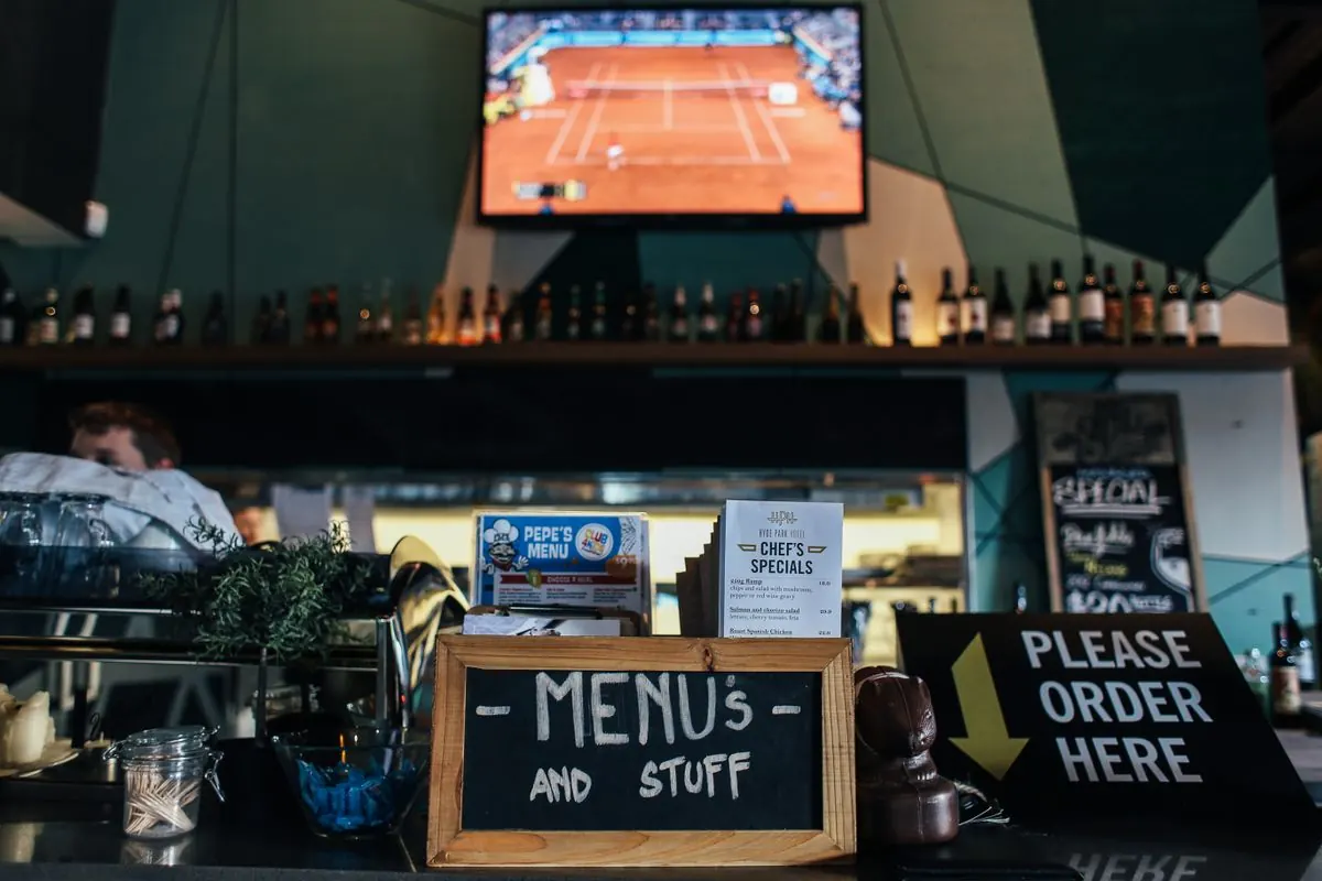 Counter service restaurant with a chalkboard menu, a common Square POS setup