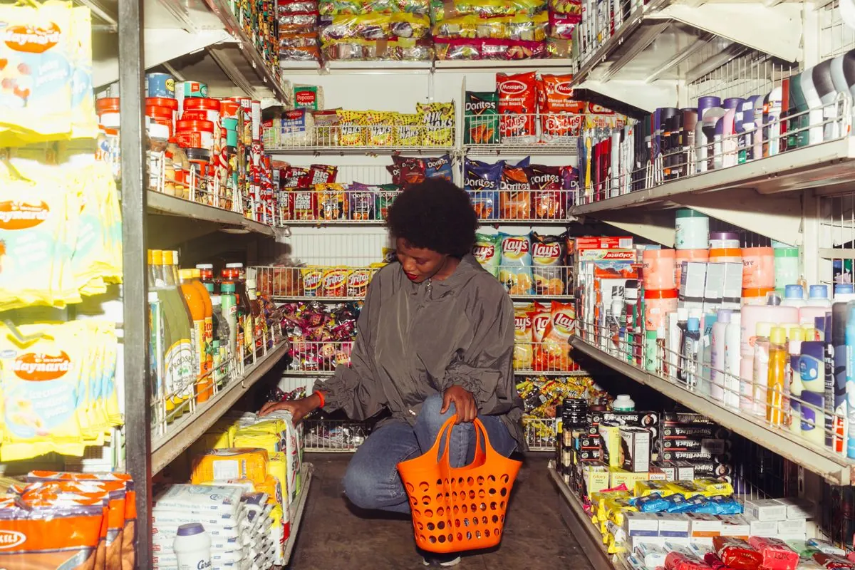 Shopper at stocked grocery shelves, an inventory heavy KORONA POS use case